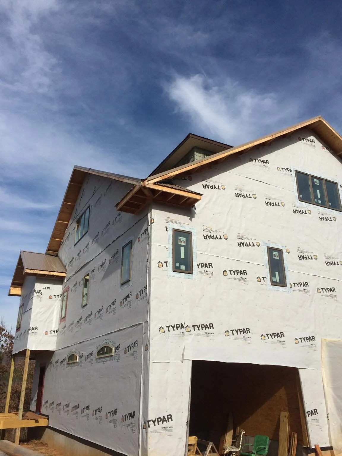Stick built house wrapped in Typar with new roof framing and dormers in Clinton